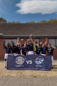 The APC Team Scores Big for Promise Dreams Charity Football Tournament